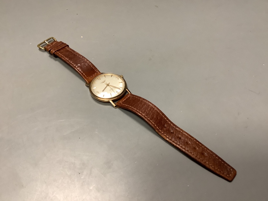 A gentleman's 9ct gold Longines Flagship automatic wristwatch, on a leather strap, with Longines box, case diameter 36mm, excluding crown, gross 36.8 grams.
